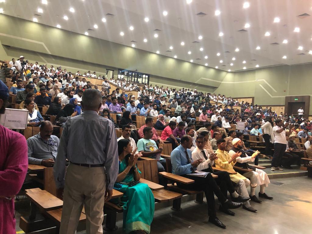 Students and community members gathered in an educational auditorium